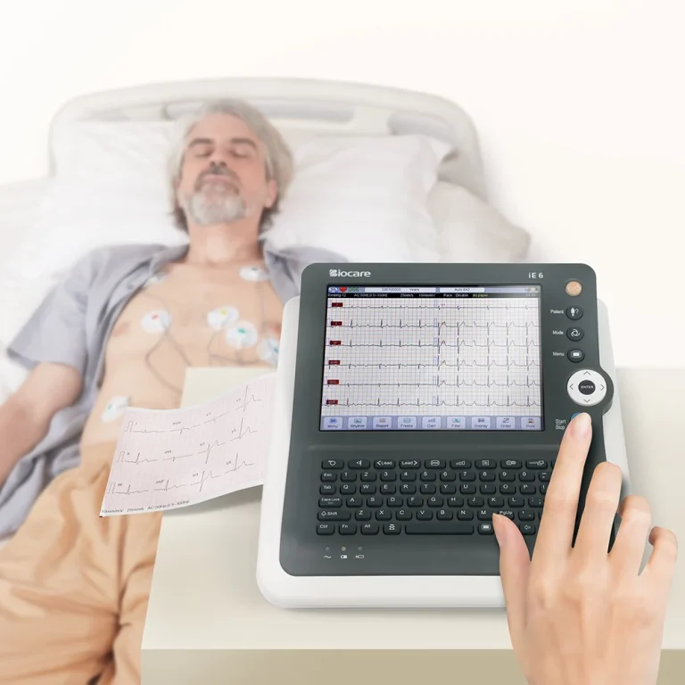 Indian cardiologist analyzing ECG report on digital monitor